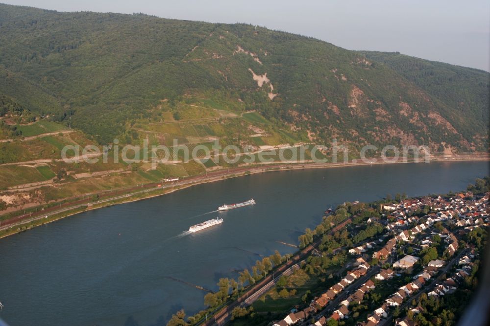 Trechtingshausen from the bird's eye view: The local community Trechtingshausen with the unique landscape of the romantic Rhine Valley, surrounded by mountains, forests and vineyards. The village is on the banks of the Rhine in Rhineland-Palatinate