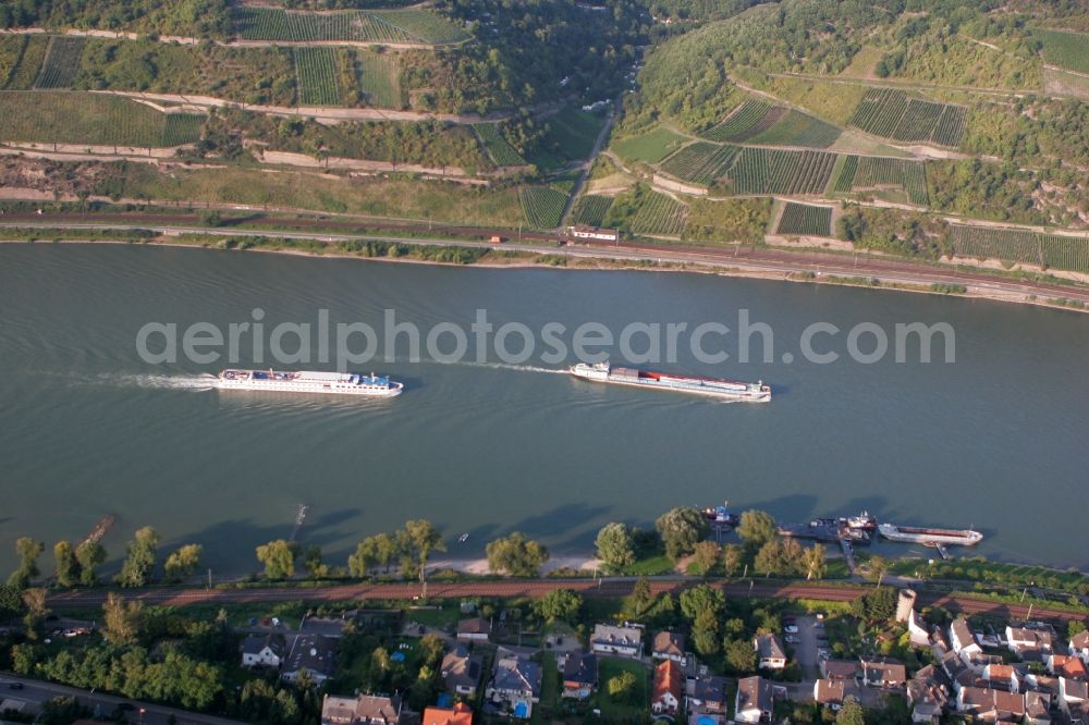 Aerial image Trechtingshausen - The local community Trechtingshausen with the unique landscape of the romantic Rhine Valley, surrounded by mountains, forests and vineyards. The village is on the banks of the Rhine in Rhineland-Palatinate