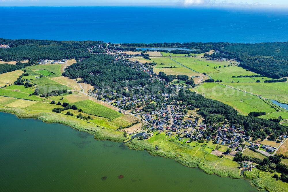 Seebad Loddin from the bird's eye view: Village on the banks of the area lake of Achterwassers in Loddin on the island of Usedom in the state Mecklenburg - Western Pomerania, Germany