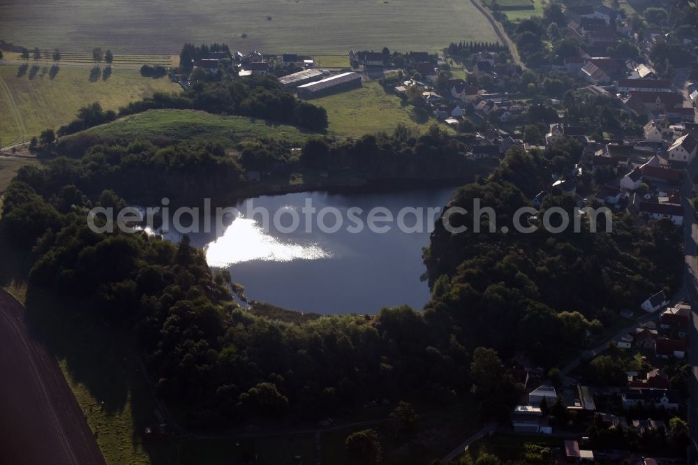 Böhlitz from the bird's eye view: Village on the banks of the area old mining lake in Boehlitz in the state Saxony