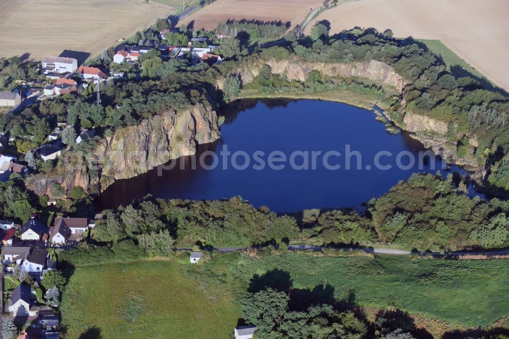 Böhlitz from the bird's eye view: Village on the banks of the area old mining lake in Boehlitz in the state Saxony