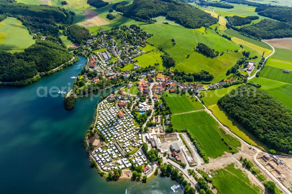 Heringhausen from the bird's eye view: Village on the banks of the area of Diemel in Heringhausen in the state Hesse, Germany