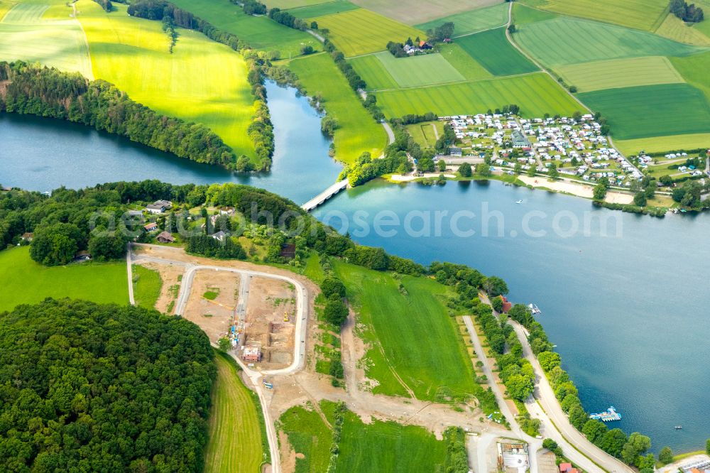 Heringhausen from the bird's eye view: Village on the banks of the area of Diemelsee in Heringhausen in the state Hesse, Germany