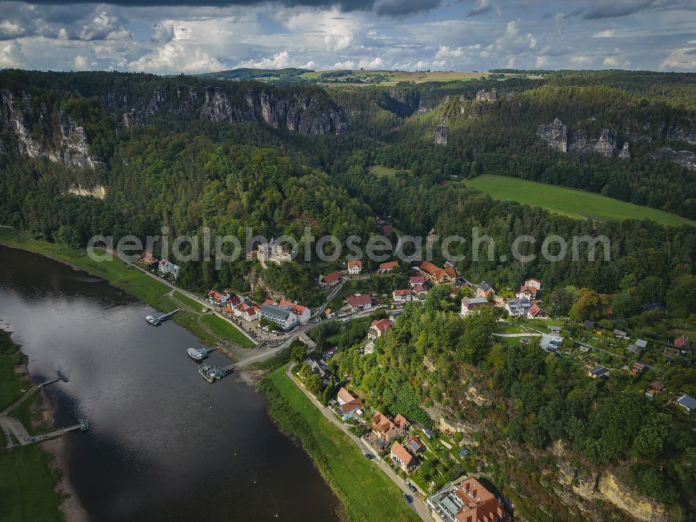 Rathen from the bird's eye view: Village on the banks of the area Elbe - river course on street Trebenweg in Rathen Basteigebiet in the state Saxony, Germany