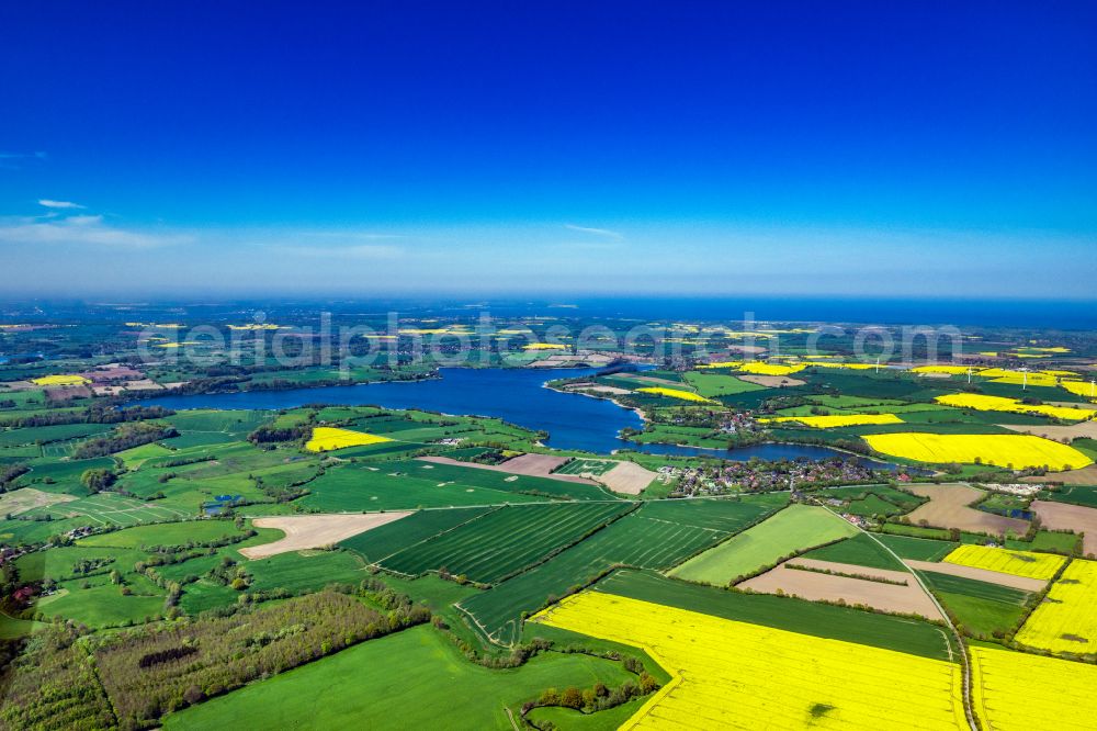 Stoltenberg from above - Village on the banks of the area lake of Passader See on street Dorfstrasse in Stoltenberg in the state Schleswig-Holstein, Germany