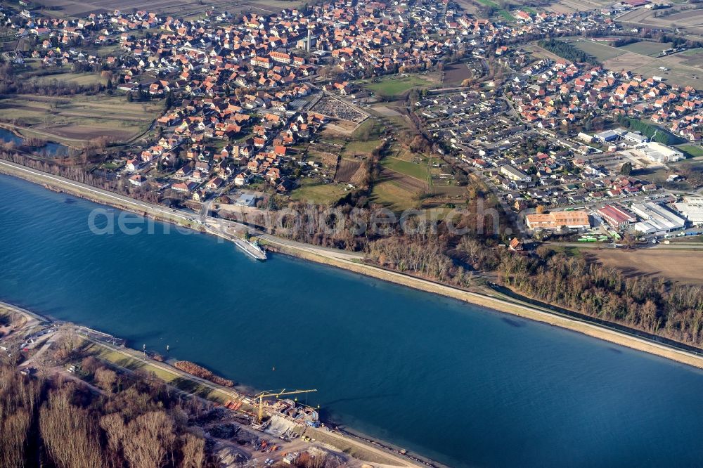 Rhinau from above - Village on the banks of the area Rhine - river course in Rhinau in Grand Est, France