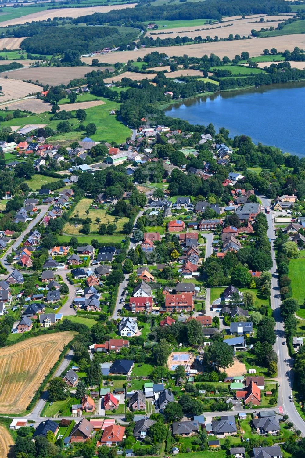 Groß Wittensee from the bird's eye view: Village on the banks of the area lake of Wittensee in Gross Wittensee in the state Schleswig-Holstein, Germany