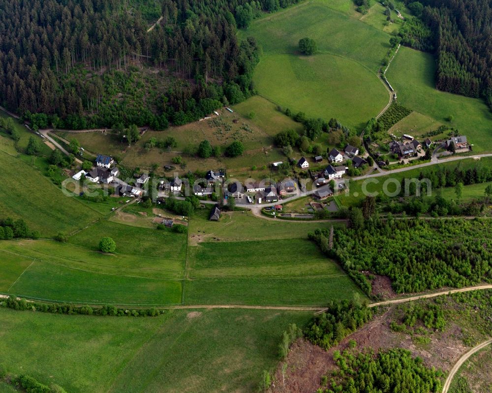 Friesenhagen from the bird's eye view: View of the Bettorf part of Friesenhagen in the state of Rhineland-Palatinate. Bettorf with its residential buildings and farms is located in the borough of Friesenhagen, the Northern-most borough of the state. The village is surrounded by fields, forest and hills