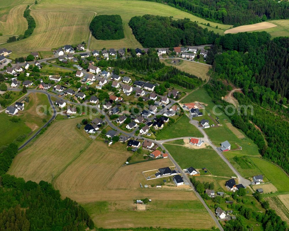 Aerial photograph Birken-Honigsessen - View of the Birken part of Birken-Honigsessen in the state of Rhineland-Palatinate. The centre of the municipiality consists of two separate but now connected villages: Birken and Honigsessen. The borough is located in the Wildenburger Land region and is surrounded by wooded hills and fields