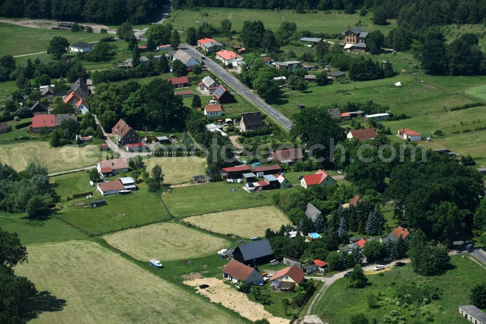 Schwarz from above - View of the village of Buschhof in the county of Schwarz in the state of Mecklenburg - Western Pomerania. The village is surrounded by fields and located on the edge of a forest and along Wittstocker Strasse, the L25