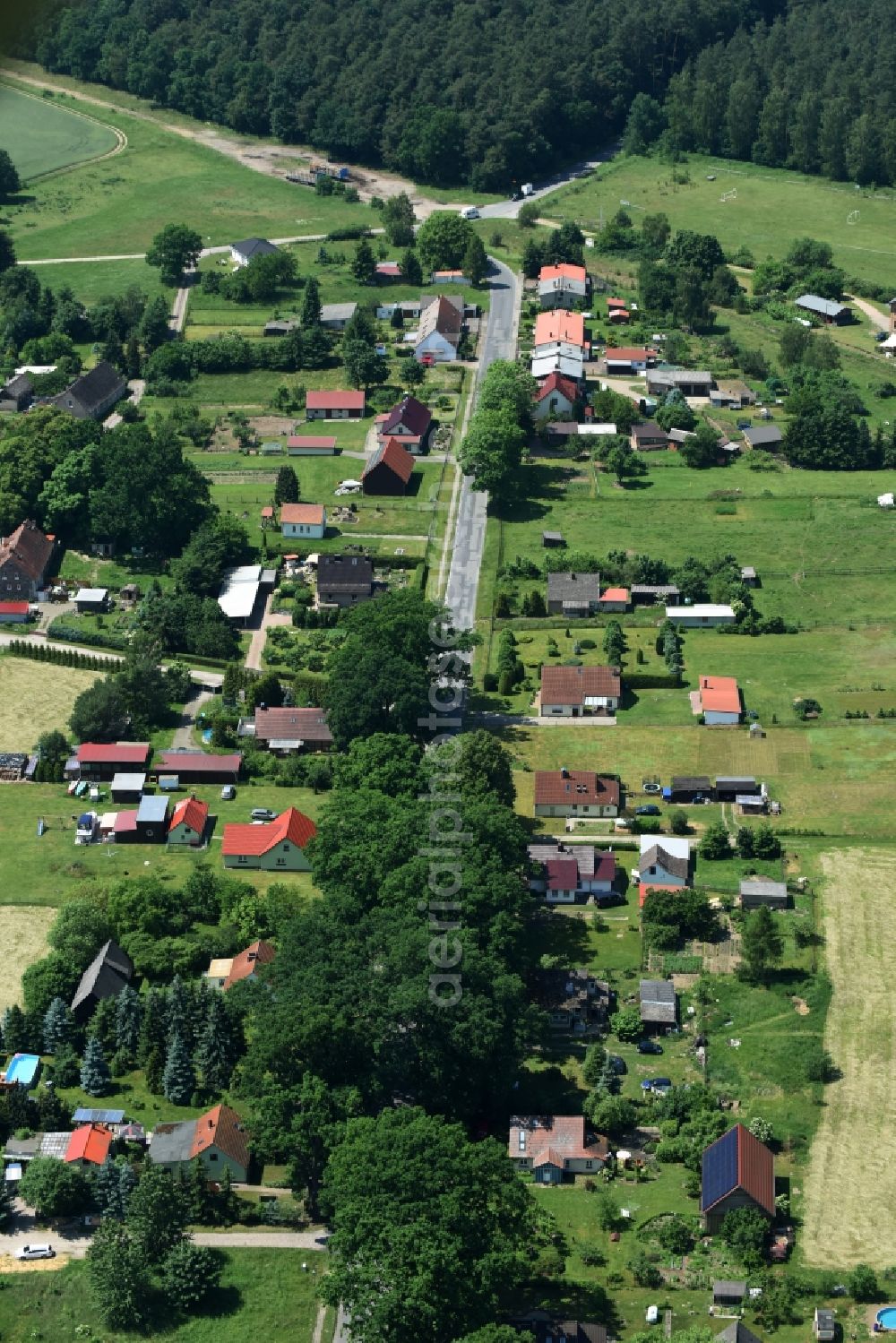 Schwarz from above - View of the village of Buschhof in the county of Schwarz in the state of Mecklenburg - Western Pomerania. The village is surrounded by fields and located on the edge of a forest and along Wittstocker Strasse, the L25