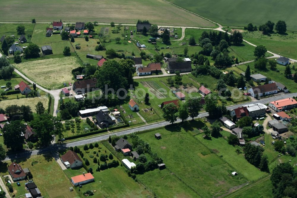 Schwarz from the bird's eye view: View of the village of Buschhof in the county of Schwarz in the state of Mecklenburg - Western Pomerania. The village is surrounded by fields and located on the edge of a forest and along Wittstocker Strasse, the L25