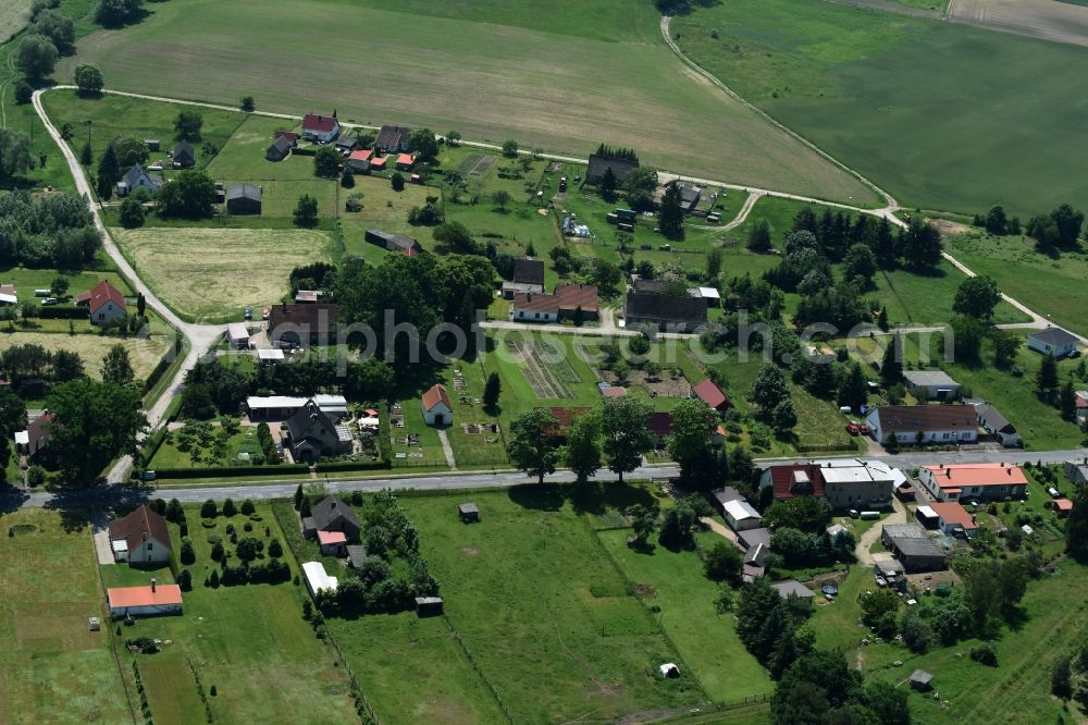 Aerial photograph Schwarz - View of the village of Buschhof in the county of Schwarz in the state of Mecklenburg - Western Pomerania. The village is surrounded by fields and located on the edge of a forest and along Wittstocker Strasse, the L25