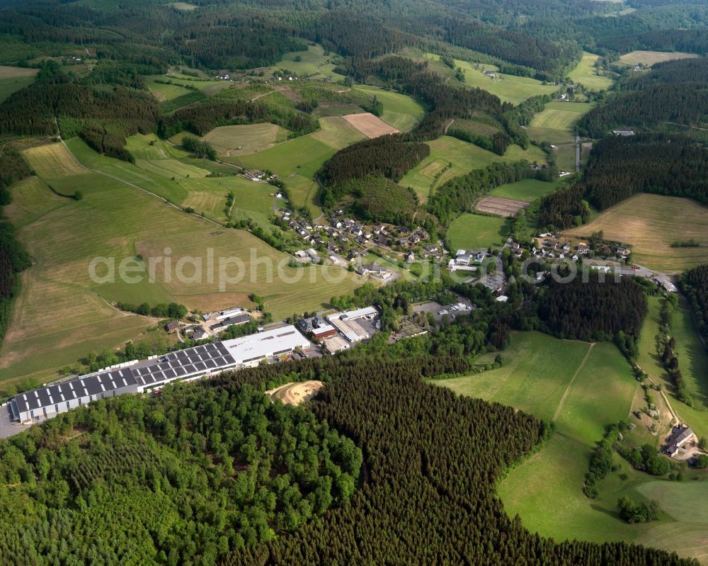 Aerial photograph Friesenhagen - View of the Steeg part of Friesenhagen in the state of Rhineland-Palatinate. Steeg with its residential buildings and farms is located in the borough of Friesenhagen, the Northern-most borough of the state. The village is surrounded by fields, forest and hills