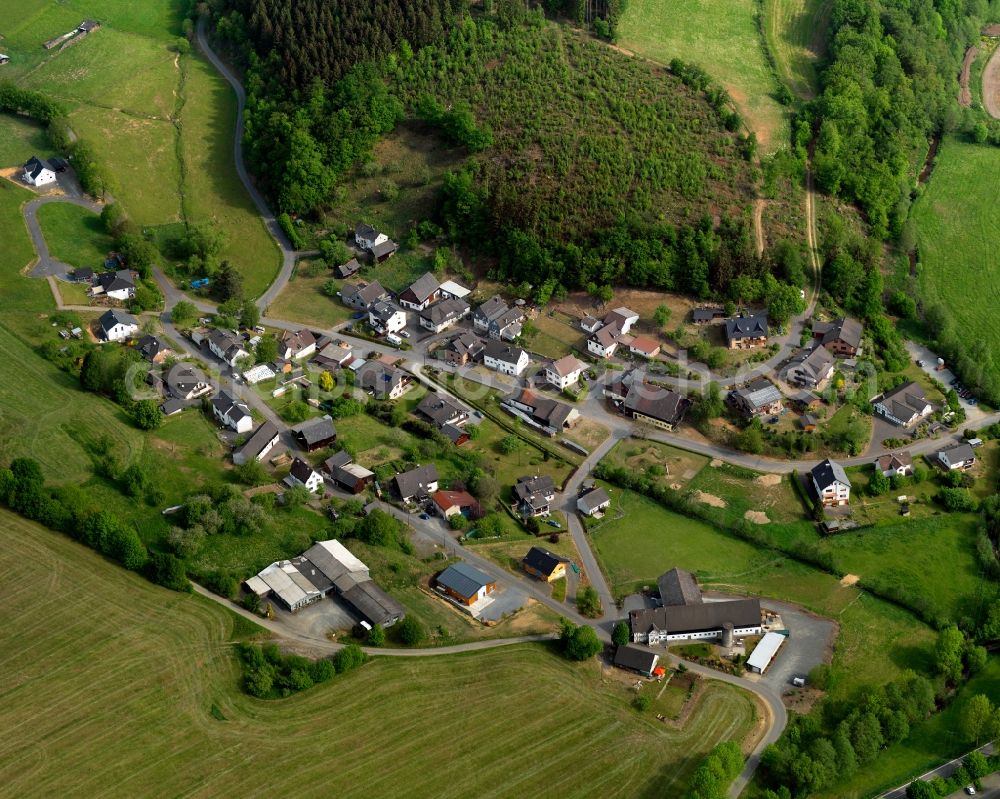 Friesenhagen from above - View of the Steeg part of Friesenhagen in the state of Rhineland-Palatinate. Steeg with its residential buildings and farms is located in the borough of Friesenhagen, the Northern-most borough of the state. The village is surrounded by fields, forest and hills