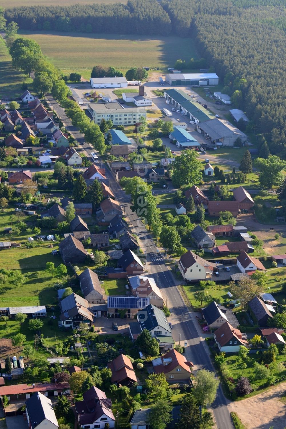 Neuruppin from the bird's eye view: View of the Guehlen-Glienicke part of the town of Neuruppin in the state of Brandenburg. Neuruppin is the main town of the Ruppiner Land region and capital of the county district of Ostprignitz-Ruppin in the North of the state. Guehlen-Glienicke is located on a forest on the county road L16 and mainly consists of single family homes and agricultural businesses