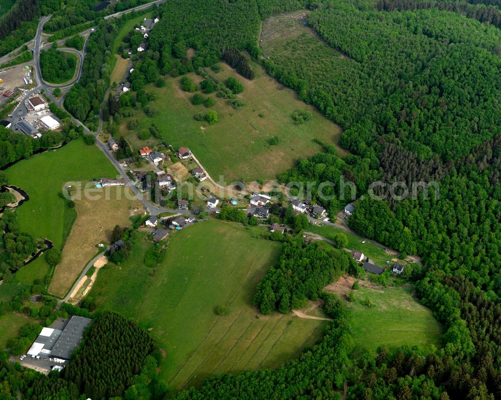 Neuwied from the bird's eye view: View of the Hahnhof part of Neuwied in the state of Rhineland-Palatinate. Hahnhof is located outside the town centre and consists of several residential buildings and agricultural estates, surrounded by forest and hills