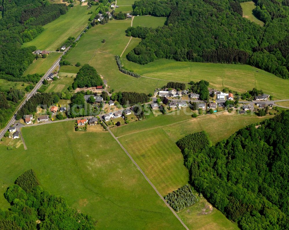 Helmeroth from the bird's eye view: View of the Helmerother Hoehe part of Helmeroth in the state of Rhineland-Palatinate. Helmeroth is a borough and municipiality Westerwald Forest region. Its centre consists of residential areas with single family units and semi-detached houses. The borough is surrounded by forest and agricultural land