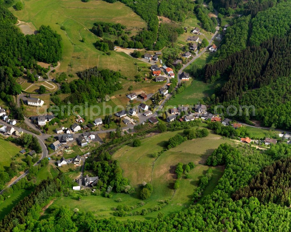 Aerial photograph Harbach - View of the Hinhausen part of Harbach in the state of Rhineland-Palatinate. Hinhausen with its residential buildings and farms is located in the borough of Harbach. The village is surrounded by fields, forest and hills