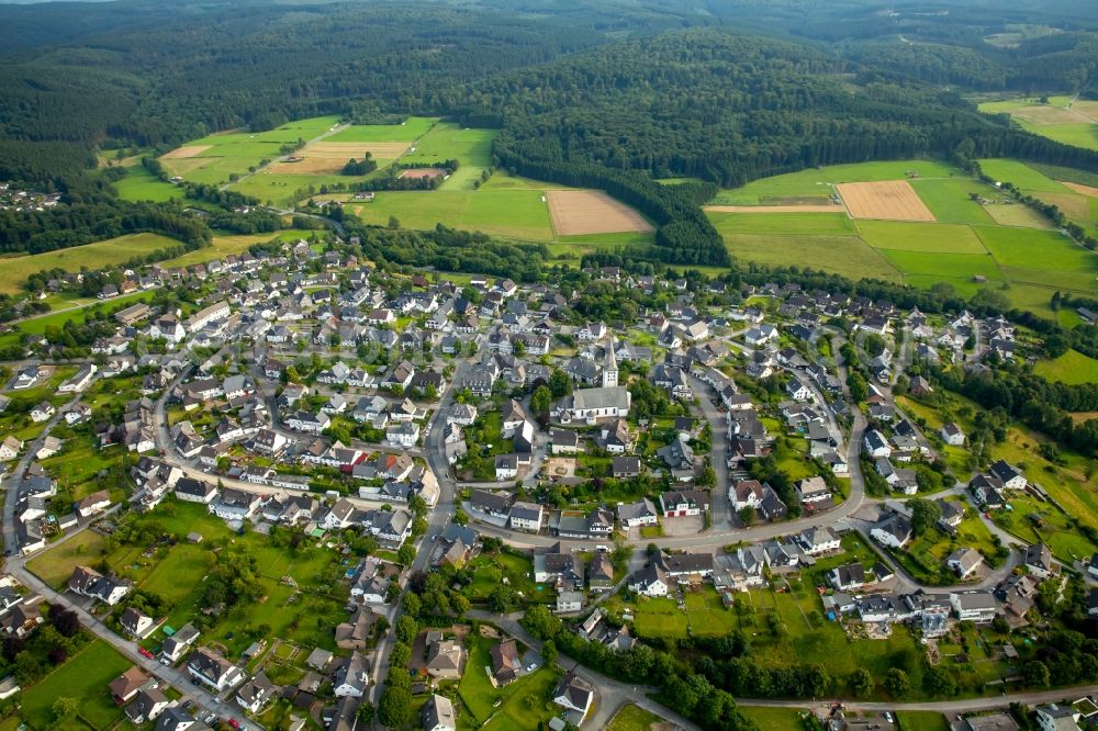 Aerial photograph Warstein - View of the Hirschberg part of the town of Warstein in the state of North Rhine-Westphalia. The village is located in the county district of Soest, in the West of the town and consists of historic residential buildings