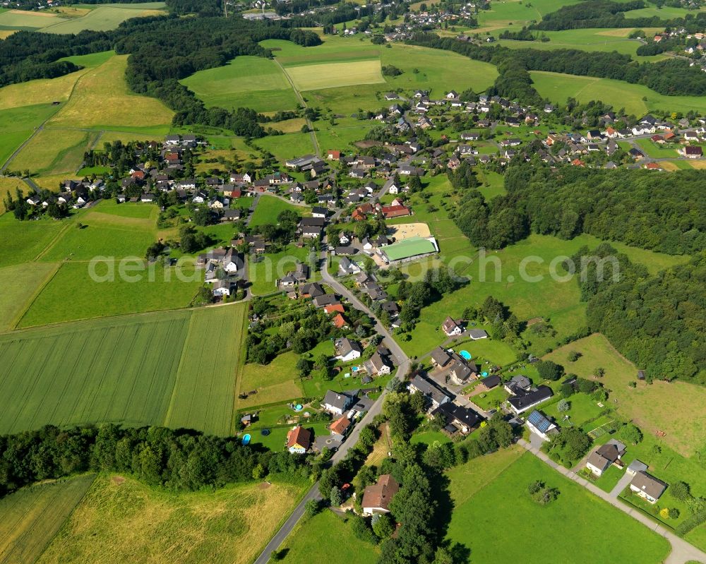 Buchholz from above - View of the Jungeroth part of Buchholz in the state of Rhineland-Palatinate. The borough and municipiality Buchholz is located in the county district of Neuwied on the edge of the Westerwald forest region and surrounded by fields, meadows and hills. Jungeroth is located in the Northwest of the core village on a wooded hill