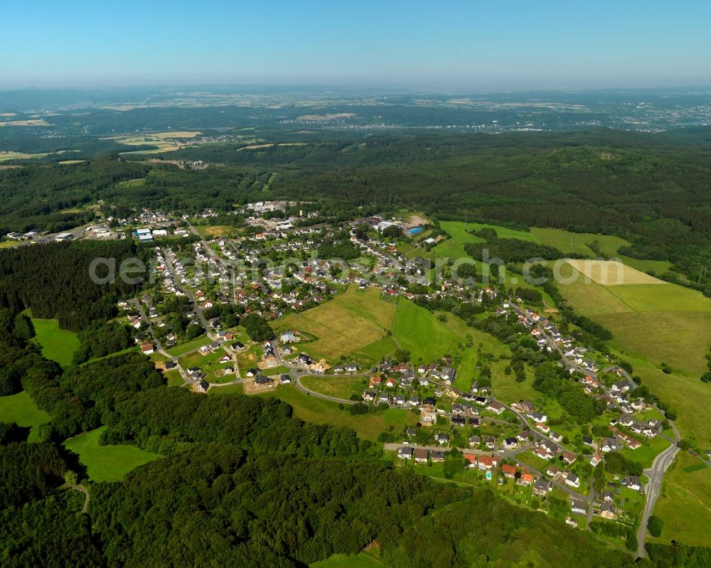 Vettelschoß from above - View of the Kalenborn part of Vettelschloss in the state of Rhineland-Palatinate. The borough and municipiality Vettelschloss is located in the county district of Neuwied on the Asbacher Hochflaeche plateau in the Western foothills of Westerwald forest region. It is surrounded by forest, meadows and fields. The agriculturally informed Kalenborn is located in the West of the core village, surrounded by forest