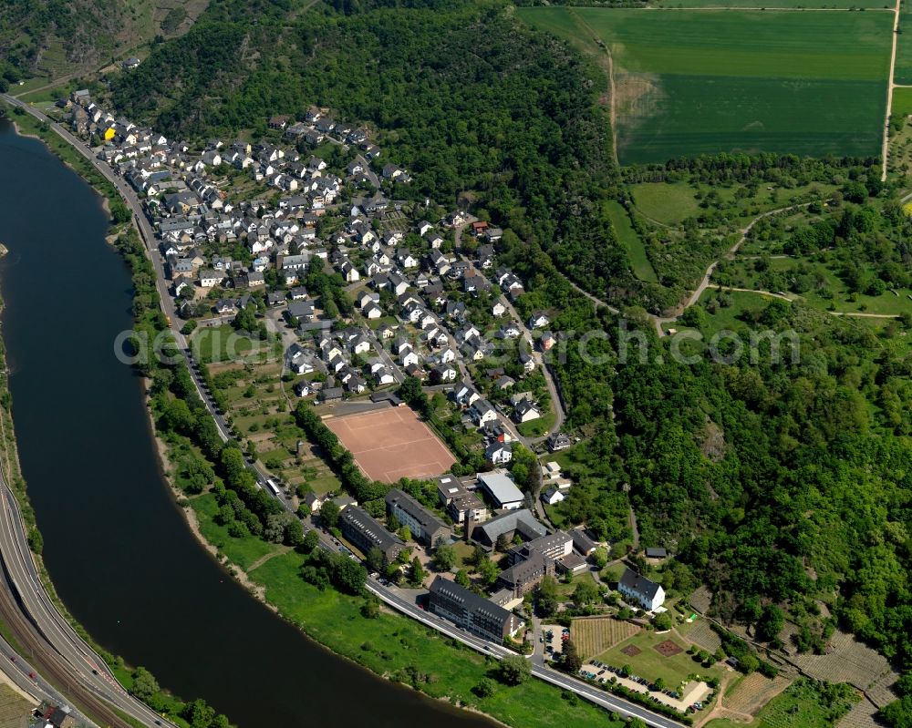 Niederfell from above - View of the Kuehr part of Niederfell in the state of Rhineland-Palatinate. The borough and municipiality is located in the county district of Mayen-Koblenz on the right riverbank of the river Moselle, surrounded by hills and vineyards. Niederfell is an official tourist resort in the Terrassenmosel region. Kuehr includes sports facilities