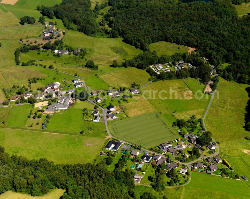 Asbach from above - View of the Koettingen part of Asbach in the state of Rhineland-Palatinate. The borough and municipiality Asbach is located in the county district of Neuwied in the Niederwesterwald forest region between the Nature parks Rhine-Westerwald and Bergisches Land. Koettingen is a small hamlet in the East of the core village, which is - because of a camping site and the mill of Koettingen - also touristically informed