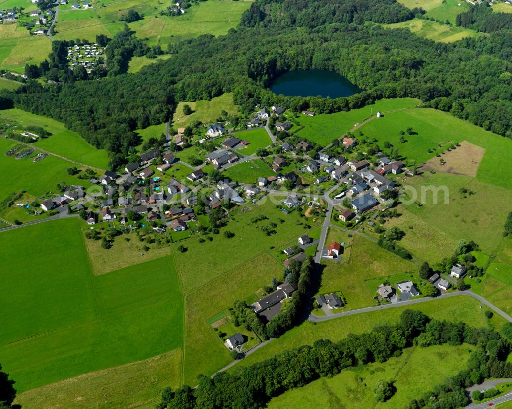 Asbach from the bird's eye view: View of the Koettingen part of Asbach in the state of Rhineland-Palatinate. The borough and municipiality Asbach is located in the county district of Neuwied in the Niederwesterwald forest region between the Nature parks Rhine-Westerwald and Bergisches Land. Koettingen is a small hamlet in the East of the core village, which is - because of a camping site and the mill of Koettingen - also touristically informed