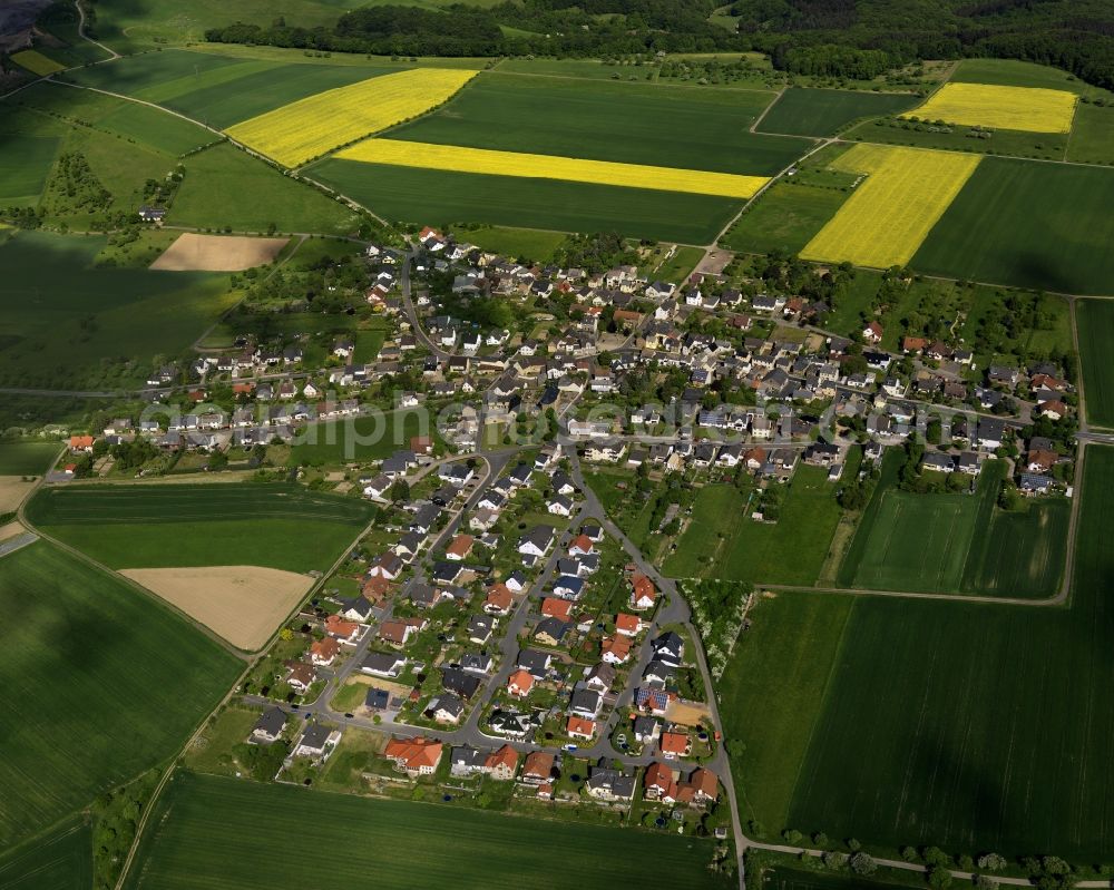 Aerial photograph Burgbrohl - View of the Luetzingen part of the borough of Burgbrohl in the state of Rhineland-Palatinate. Luetzingen is located in the North of the borough. Its residential area is agriculturally informed and surrounded by fields - rapeseed fields - and agricultural land