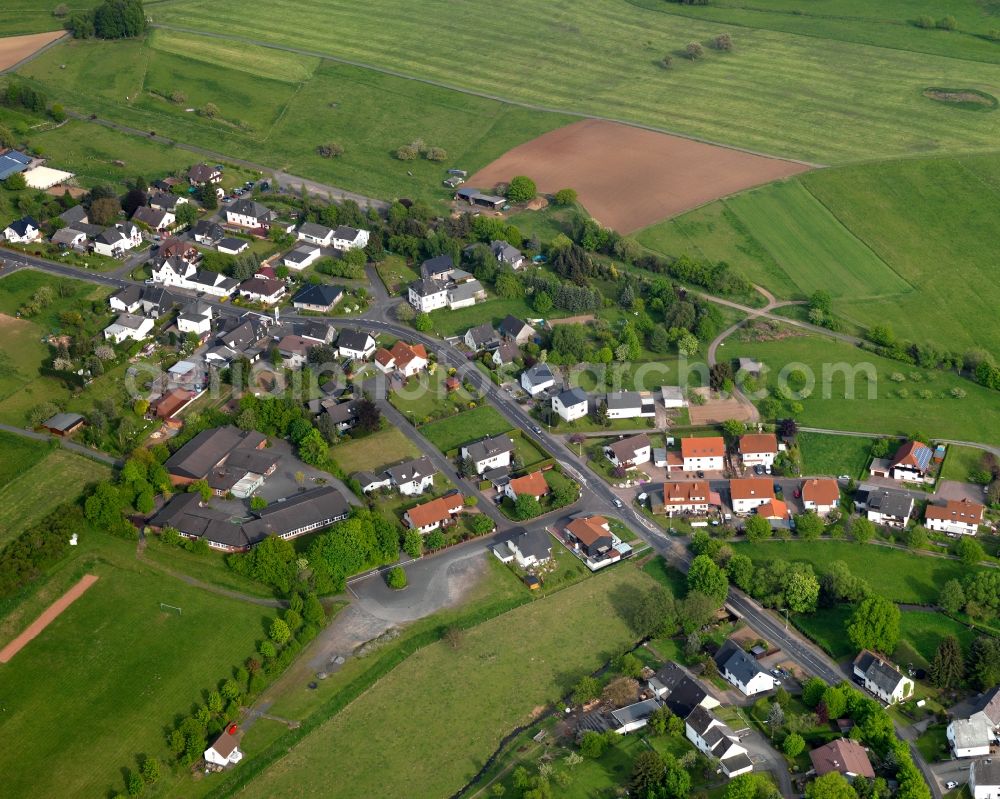 Aerial photograph Kölbingen - View of the Moellingen part of Koelbingen in the state of Rhineland-Palatinate. The borough and municipiality Koelbingen is located in the county district of Westerwaldkreis and is a rural residential borough. Koelbingen is surrounded by agricultural land, hills and meadows and located in a valley between Geisenwald forest and Ruhscheid. It consists of three part such as Moellingen