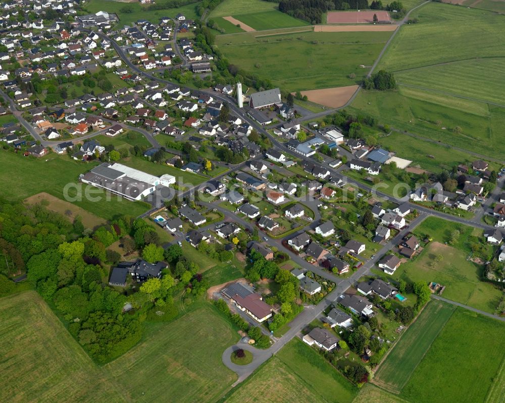 Kölbingen from above - View of the Moellingen part of Koelbingen in the state of Rhineland-Palatinate. The borough and municipiality Koelbingen is located in the county district of Westerwaldkreis and is a rural residential borough. Koelbingen is surrounded by agricultural land, hills and meadows and located in a valley between Geisenwald forest and Ruhscheid. It consists of three part such as Moellingen