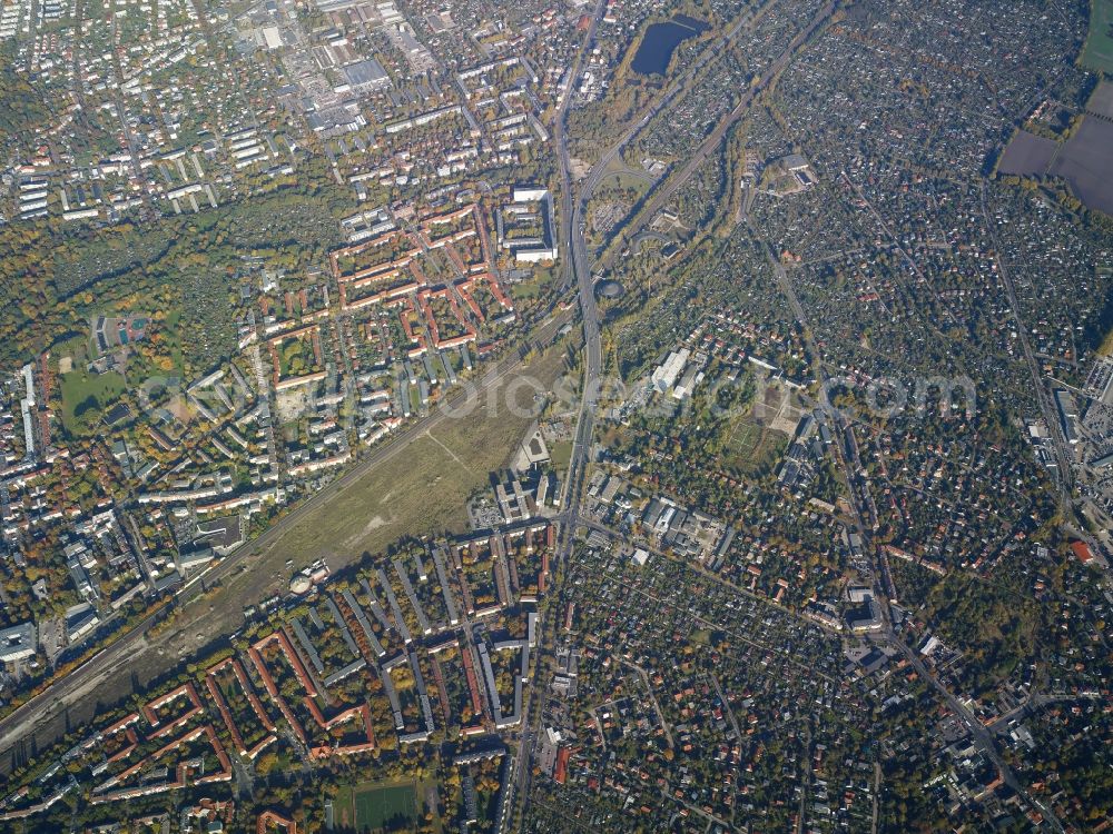 Berlin from above - View of the Niederschoenhausen and Heinersdorf parts of the district of Pankow in Berlin. Overground rail tracks run along a large green space on Damerow Street. The city motorway A114 ends here and joins Prenzlauer Promenade parallel to Pasewalker Street