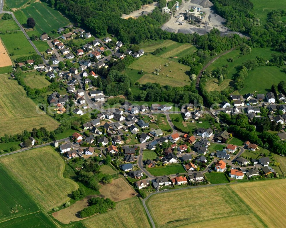 Dreikirchen from above - View of the Puetschbach part of Dreikirchen in the state of Rhineland-Palatinate. The borough and municipiality is located in the county district of Westerwaldkreis in the South of the low mountain range of Westerwald. Dreikirchen is surrounded by agricultural land, forest and meadows. It includes the parts and hamlets of Oberhausen and Puetschbach