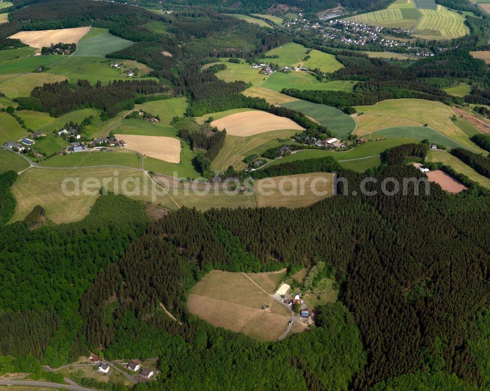 Aerial photograph Mittelhof - View of the Oberkrombach, Huengesberg and Roettgen parts of Mittelhof in the state of Rhineland-Palatinate. Mittelhof is the centre of the municipiality and official tourist resort Mittelhof and consists of several residential areas and agricultural businesses. The borough consists of several hamlets, estates and farms like the ones seen here