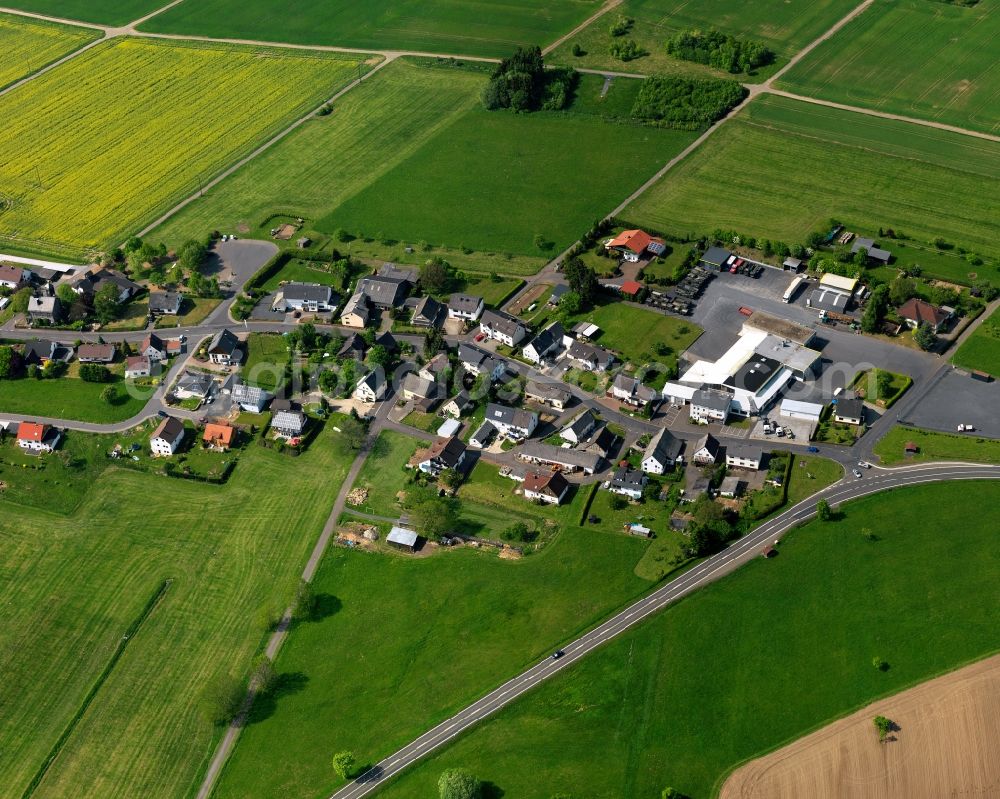 Aerial image Rothenbach - View of the Obersayn part of Rothenbach in the state of Rhineland-Palatinate. The borough and municipiality Rothenbach is located in the county district of Westerwaldkreis and is a rural residential borough. Rothenbach is surrounded by agricultural land, hills and meadows and located on the federal highway B255