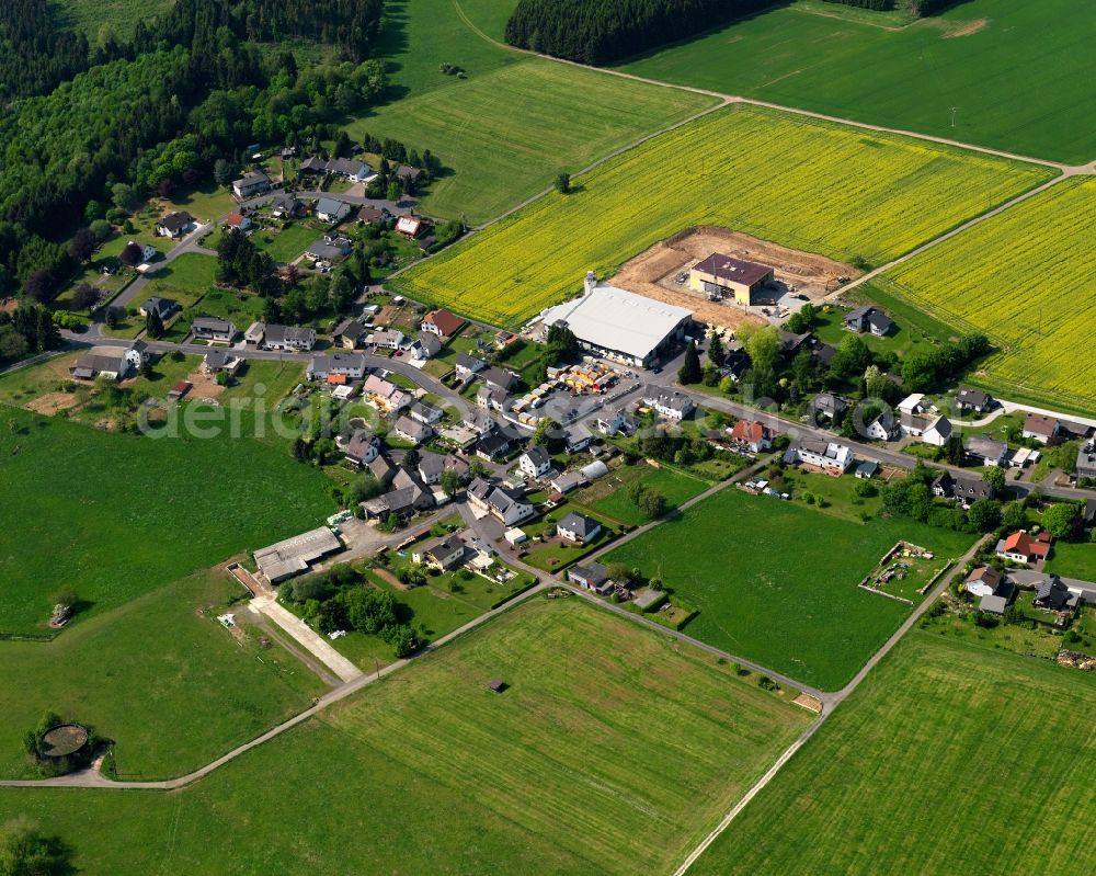 Aerial photograph Rothenbach - View of the Obersayn part of Rothenbach in the state of Rhineland-Palatinate. The borough and municipiality Rothenbach is located in the county district of Westerwaldkreis and is a rural residential borough. Rothenbach is surrounded by agricultural land, hills and meadows and located on the federal highway B255