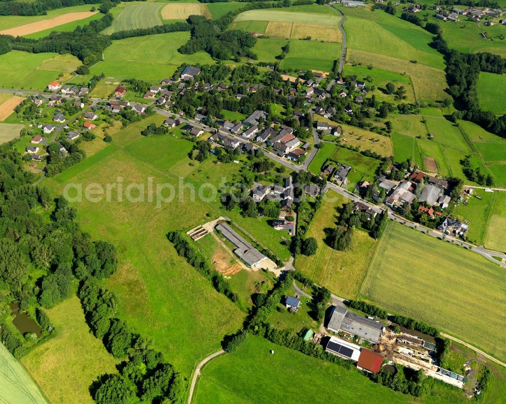 Buchholz from above - View of the Oberscheid part of Buchholz in the state of Rhineland-Palatinate. The borough and municipiality Buchholz is located in the county district of Neuwied on the edge of the Westerwald forest region and surrounded by fields, meadows and hills. Oberscheid is also known as the chapel village and is home to a horse riding farm