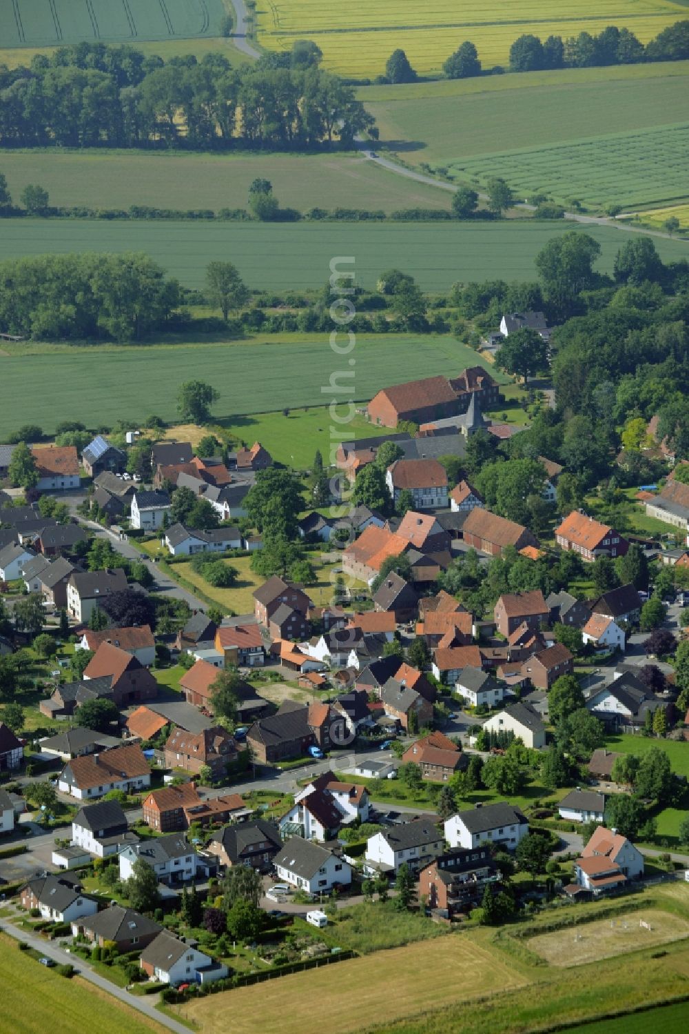 Welver from the bird's eye view: View of the Borgeln part of the borough of Welver in the state of North Rhine-Westphalia. The borough is located in the county district of Soest. The village is surrounded by forest, hills and fields and consists mainly of single family houses. It is located in the Southwest of the main village