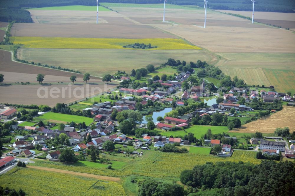 Aerial image Beiersdorf-Freudenberg - View of the Freudenberg part of the borough of Beiersdorf-Freudenberg in the state of Brandenburg. The borough is located in the county district of Maerkisch-Oderland and consists of two parts. Freudenberg is a village around two ponds in its centre and consists of residential buildings, a church and small farm estates. Wind turbines are located in the background