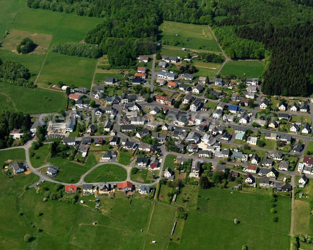 Aerial photograph Höhn - View of the Neuhochstein part of the borough of Hoehn in the state of Rhineland-Palatinate. The borough is located in the county district and region of Westerwald. The residential village is surrounded by fields and meadows. It sits right on federal highway B255 and consists of several parts. Neuhochstein is located on a forest in the West of the core village