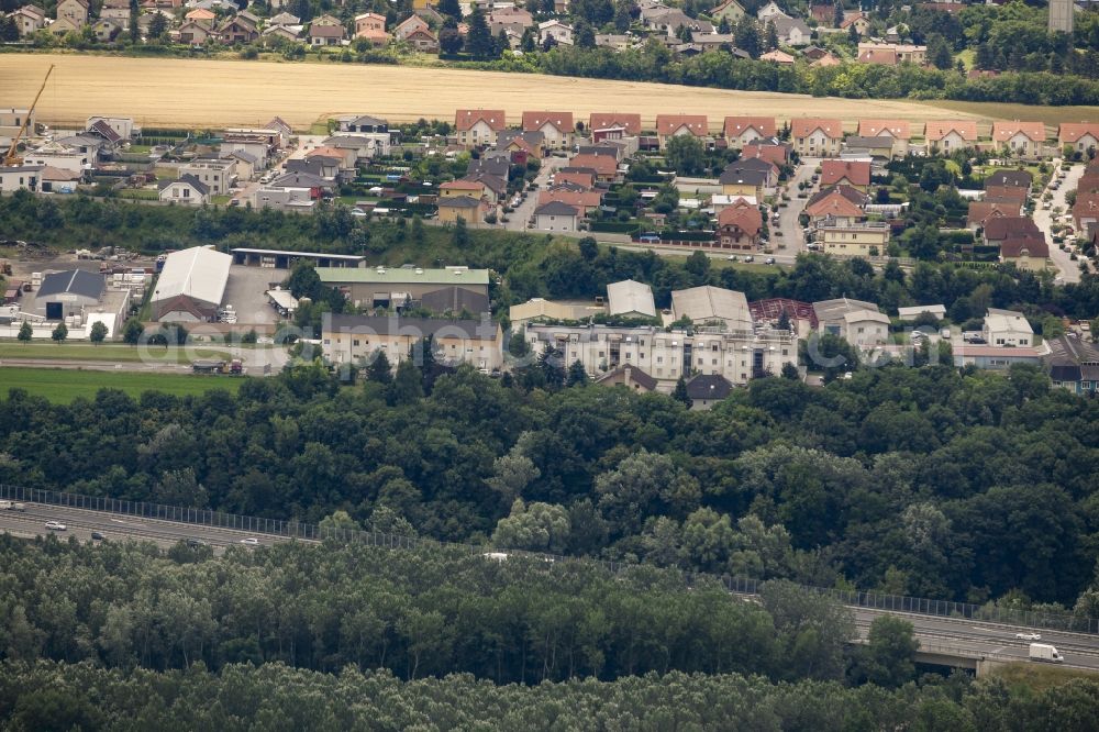 Fischamend from the bird's eye view: View of the East of Fischamend in Lower Austria, Austria. Fischamend is located on federal road B9 and the federal motorway A4. The east mainly consists of company buildings and commercial areas