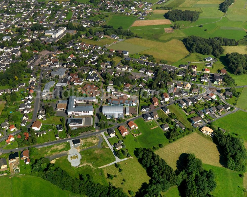 Aerial photograph Asbach - View of the East of Asbach in the state of Rhineland-Palatinate. The borough and municipiality Asbach is located in the county district of Neuwied in the Westerwald forest region and surrounded by fields, meadows and hills. The borough sits between the nature parks of Rhine-Westerwald and Bergisches Land. Konrad-Adenauer-School sits on the edge of the borough