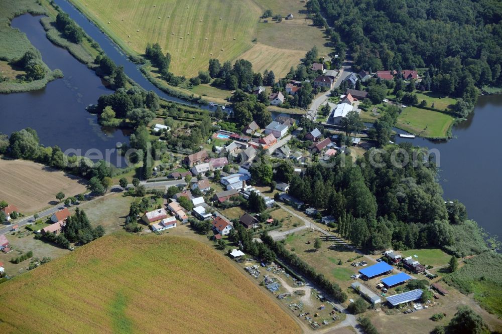 Aerial image Rietz-Neuendorf - View of the East of the village of Neubrueck on lake Wergensee in the borough of Rietz-Neuendorf in the state of Brandenburg. The residential village is surrounded by fields and forest along Spreestrasse