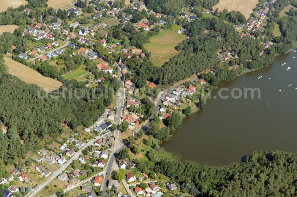 Bad Saarow from above - View of the Petersdorf part in the North of Bad Saarow in the state of Brandenburg. Petersdorf is located on the shore of Lake Petersdorfer See. The residential village is part of the official spa resort Bad Saarow in the county district of Oder-Spree