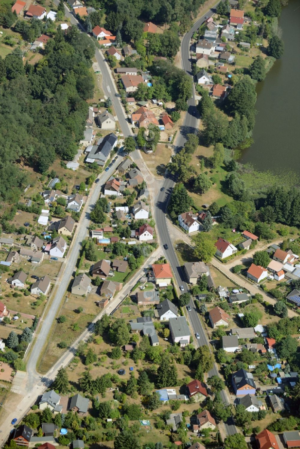 Bad Saarow from the bird's eye view: View of the Petersdorf part in the North of Bad Saarow in the state of Brandenburg. Petersdorf is located on the shore of Lake Petersdorfer See. The residential village is part of the official spa resort Bad Saarow in the county district of Oder-Spree