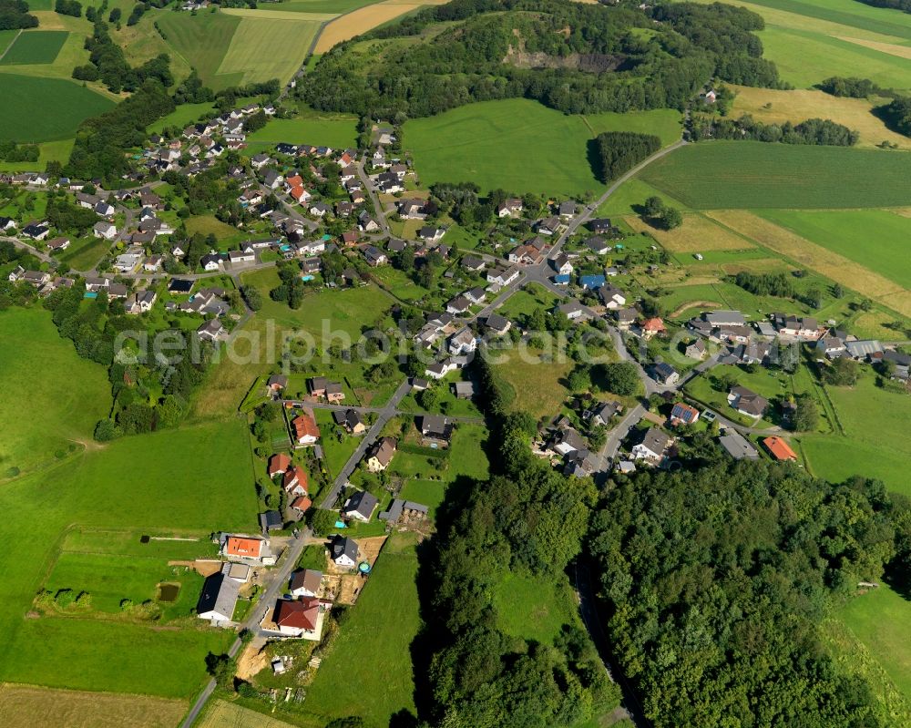 Aerial image Buchholz - View of the Priestersberg part of Buchholz in the state of Rhineland-Palatinate. The borough and municipiality Buchholz is located in the county district of Neuwied on the edge of the Westerwald forest region and surrounded by fields, meadows and hills. Priestersberg is located in the Northwest of the core village and sits right on the state border to North Rhine-Westphalia