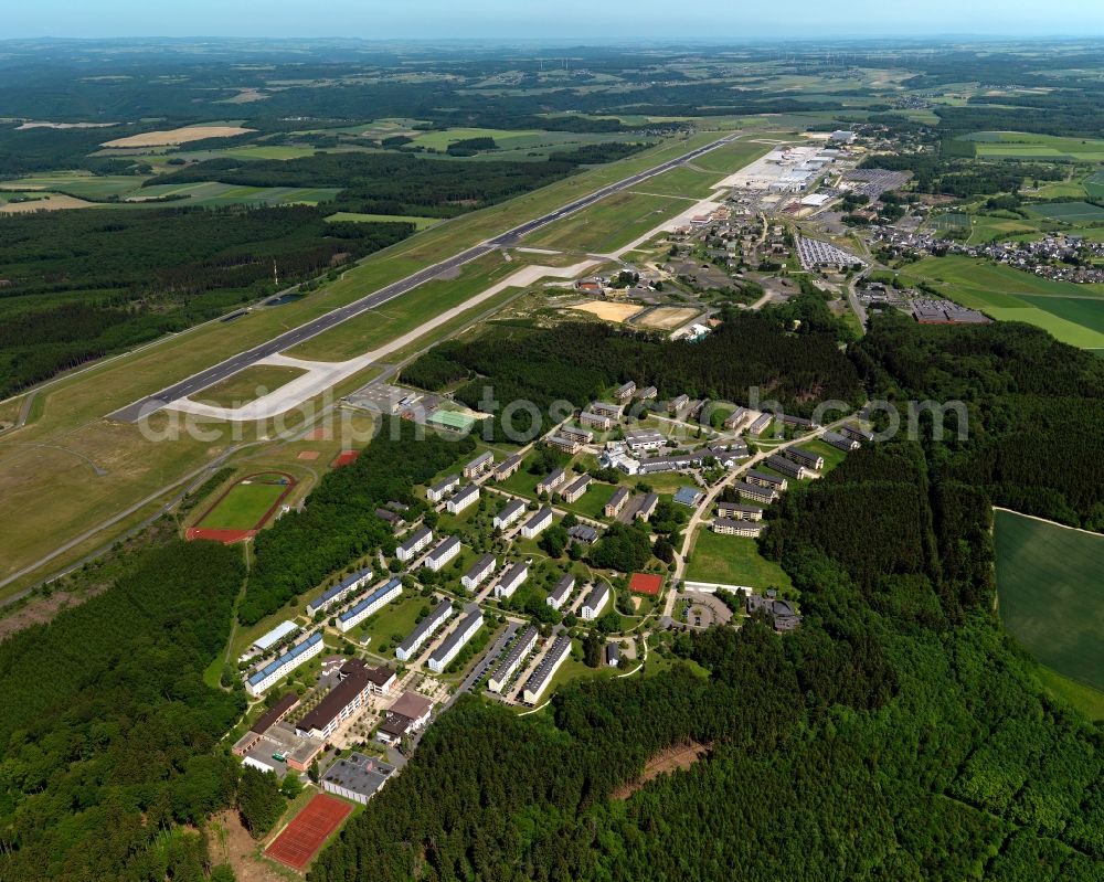 Büchenbeuren from above - View of the Scheid part of Buechenbeuren in the state of Rhineland-Palatinate. The hamlet is located adjacent to the South of Frankfurt-Hahn airport (ICAO-Code:EDFH, IATA-Code: HHN) and consists of former aiport and military buildings. Today, it is home to the state police school with its sports facilities