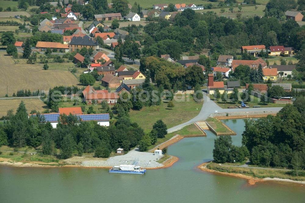 Aerial image Schlabendorf am See - View of Schlabendorf am See on Lake Schlabendorf in the state of Brandenburg. The village is located on the Northeastern shore of the lake where the marina with its harbour is located