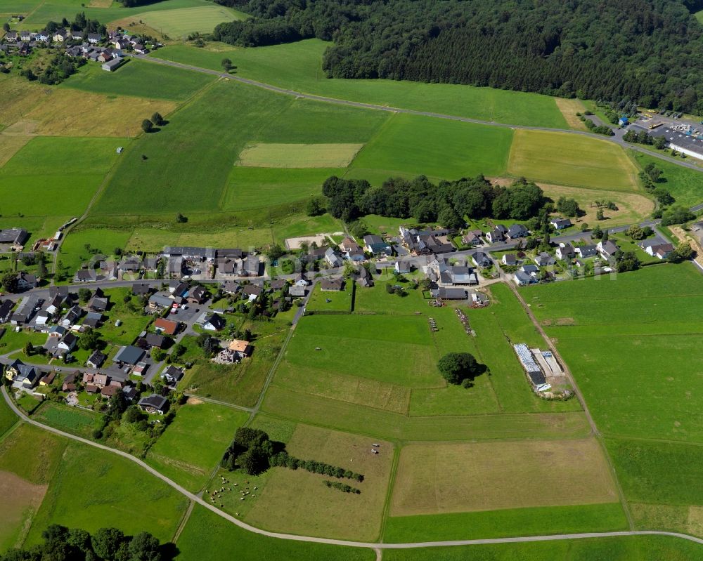 Asbach from the bird's eye view: View of the Schoeneberg part of Asbach in the state of Rhineland-Palatinate. The borough and municipiality Asbach is located in the county district of Neuwied in the Niederwesterwald forest region between the Nature parks Rhine-Westerwald and Bergisches Land. Schoeneberg is lcoated in the East of the core village on a hill above the valleys of Krumbach and Mehrbach creeks. It is agriculturally informed and consists of fields, residential buildings and farms